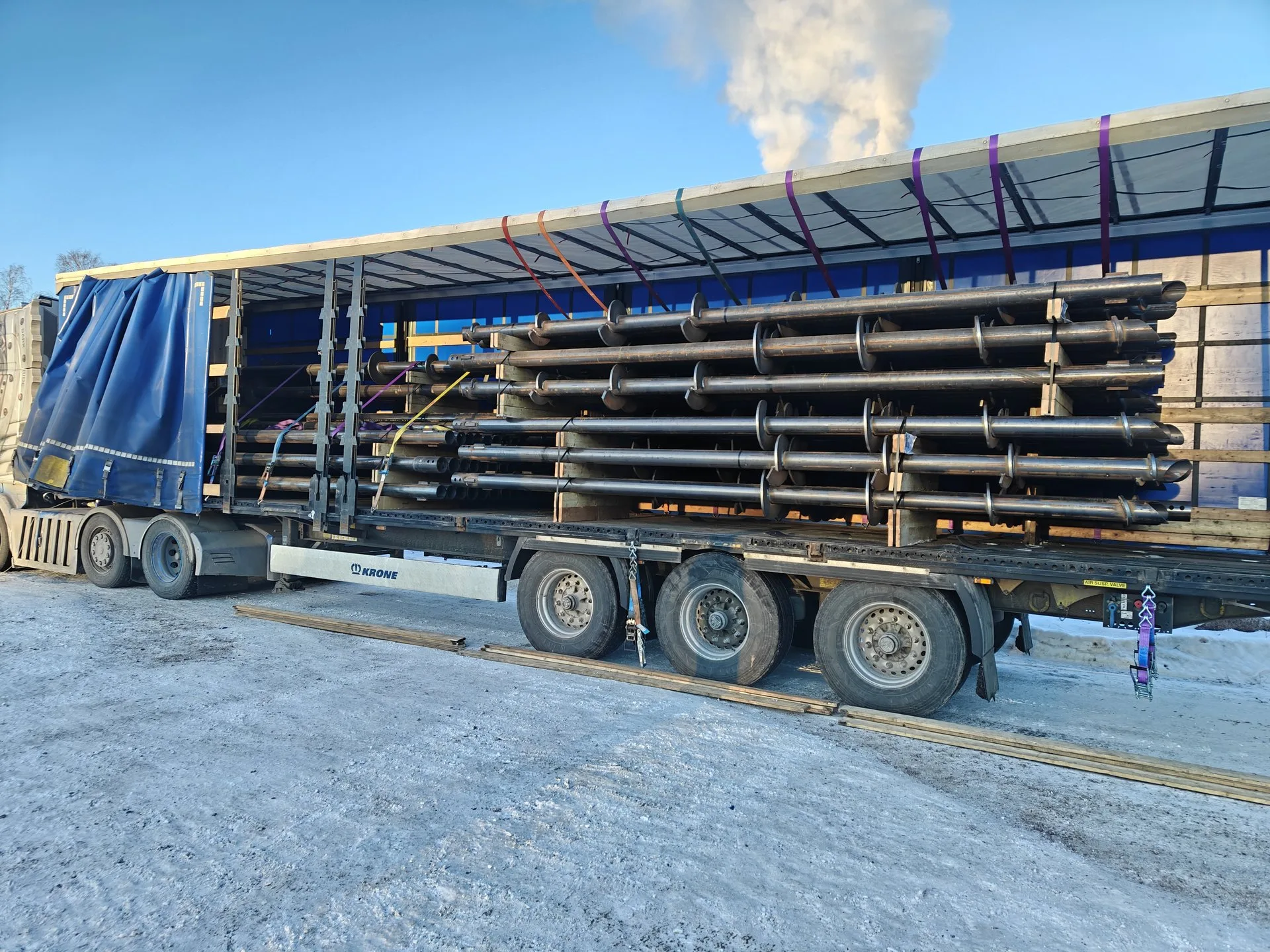 Galvanized helical piles in shaft diameters from 60.3 to 219.1 mm, loaded for delivery